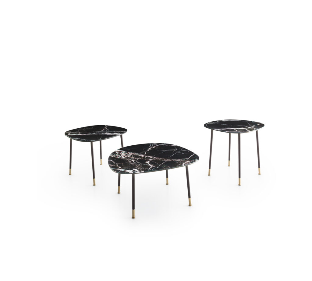 Sleek and modern coffee tables with powder-coated metal frames and brass brushed accents.