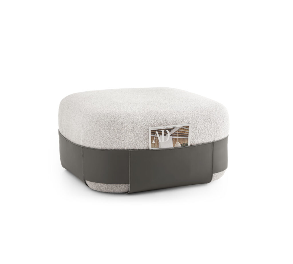 A stylish pouffe featuring high-density crushproof rubber padding and upholstery in bouclé wool and genuine leather, serving as a magazine rack and more.