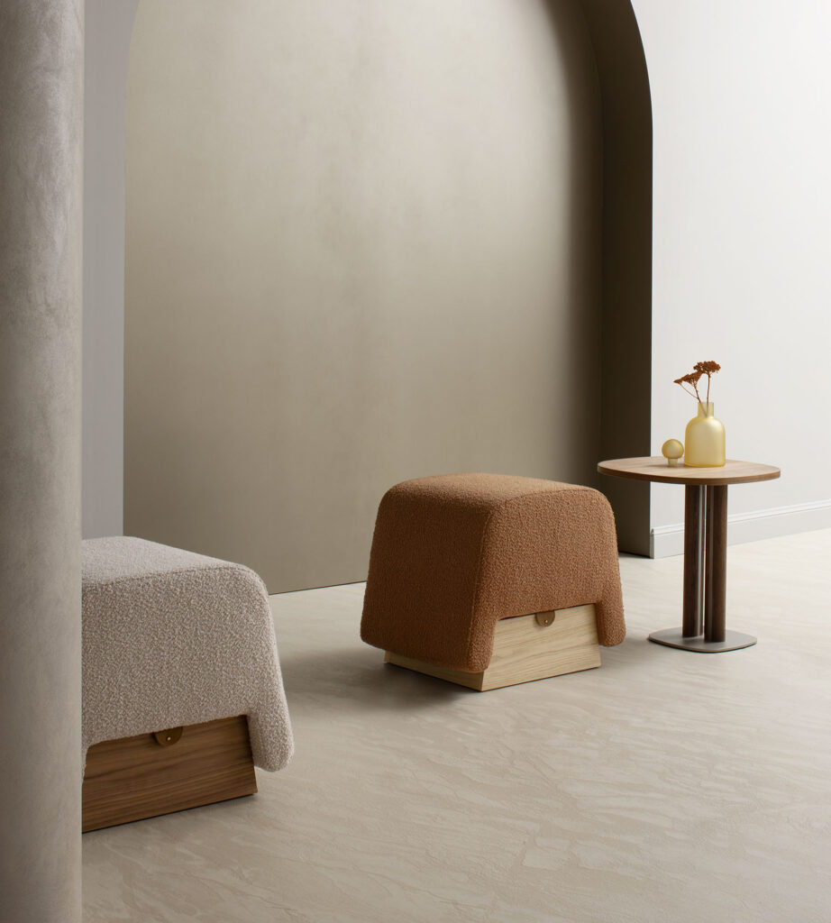 Versatile Onigiri pouf in bouclé wool, high-density padding, and natural oak storage.