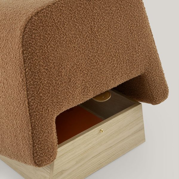 The Onigiri pouf, crafted from high-density rubber and bouclé wool, doubles as stylish seating and storage.