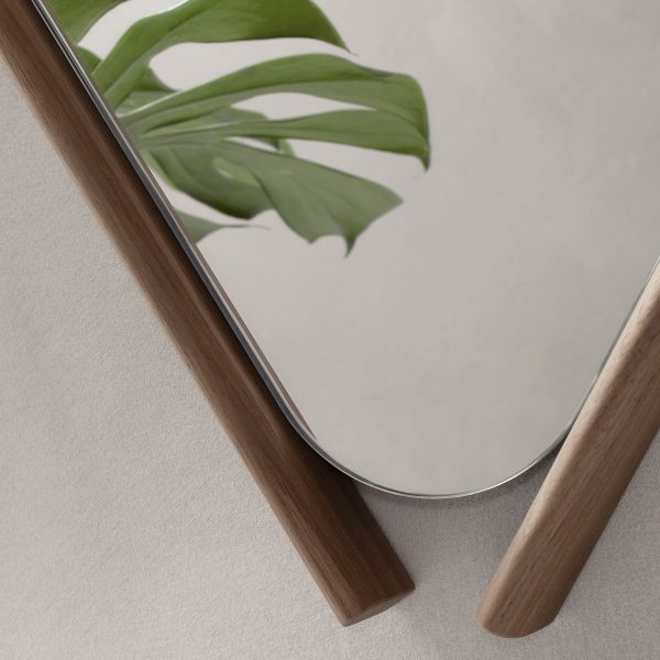 Eye-catching mirror crafted from solid wood with herringbone detailing.